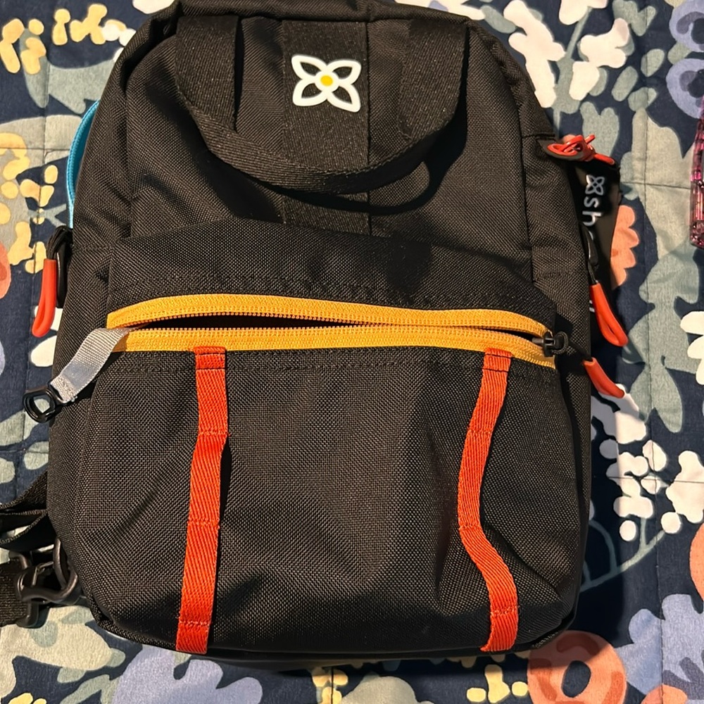 Sherpa crossbody and bag pack bag .